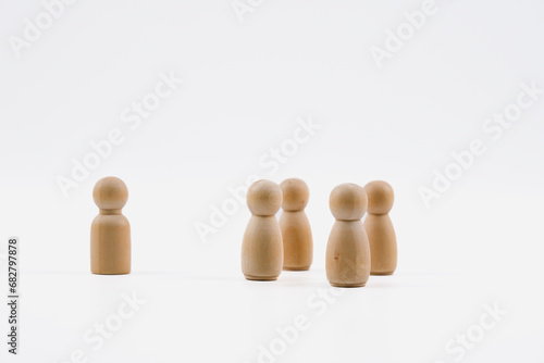 One wooden figure male and four wooden figure female. Leadership conceptual.