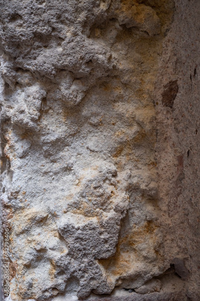 Fragment of old stone wall. Rough textured surface