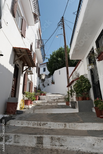 Fototapeta Naklejka Na Ścianę i Meble -  narrow street in village city, Skiathos, Greece.
