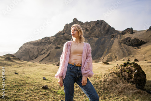 Fashion girl in a purple jacket poses in mountains © Rock and Wasp