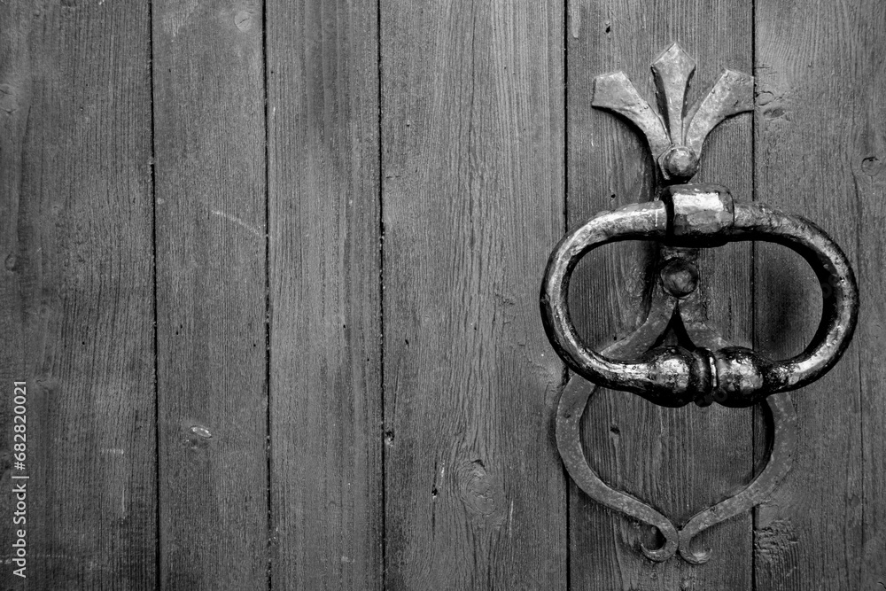 Old metal door handle in black and white. Old metal door handle in black and white.