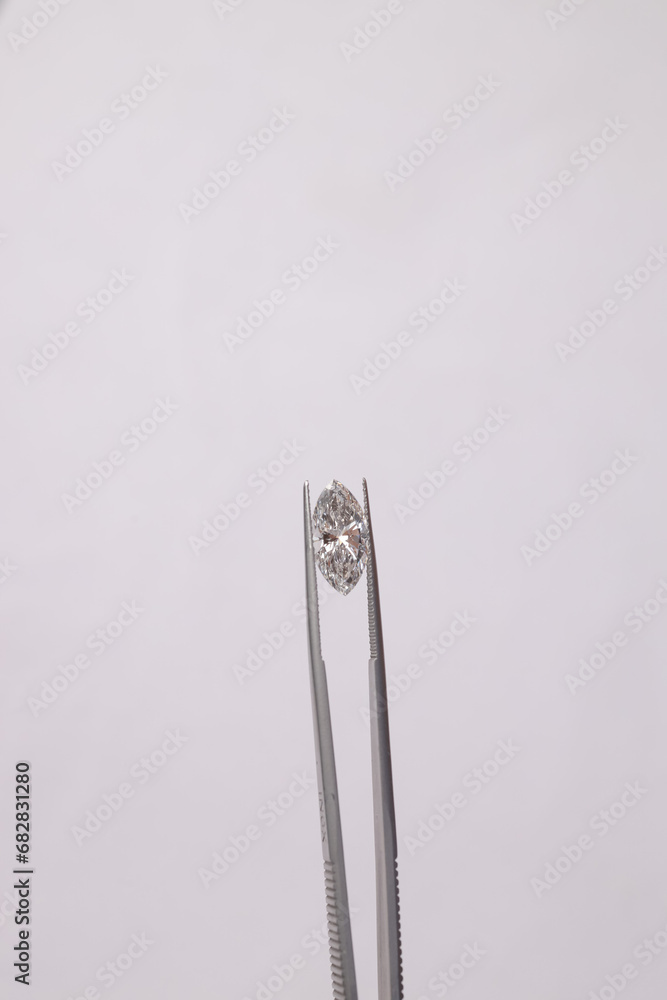 Beautiful diamonds of different carats in different shapes very beautiful and expensive with background with space for text Beautiful diamonds of different carats in different shapes very beautiful and expensive with background with space for text