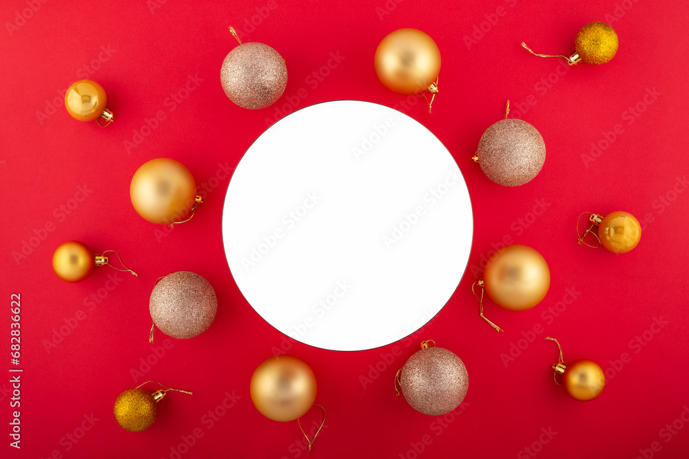 Elegant New Year arrangement in opulent hues. Overhead shot of luxurious ornaments, miniature fir accents on red backdrop, offering circe for festive wishes or promo. Elegant New Year arrangement in opulent hues. Overhead shot of luxurious ornaments, miniature fir accents on red backdrop, offering circe for festive wishes or promo.