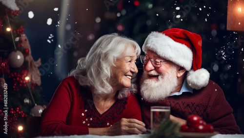 Portrait of two elderly people in love who are rejoicing at Christmas. The New Year is celebrated by old, joyful people. © Pavel