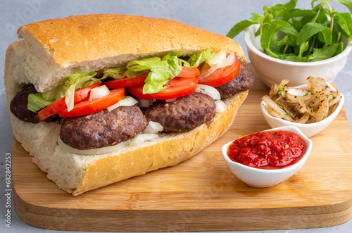 Delicious Turkish Meatballs Sandwich  Kofte Ekmek. Turkish name  kofte ekmek or ekmek arasi kofte