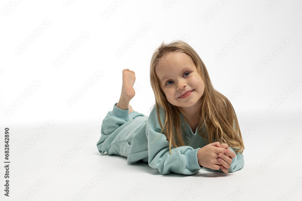 Portrait of beautiful cute little toddler girl. Child with funny face. Pretty smile kid in studio on white background. High quality photo Portrait of beautiful cute little toddler girl. Child with funny face. Pretty smile kid in studio on white background. High quality photo