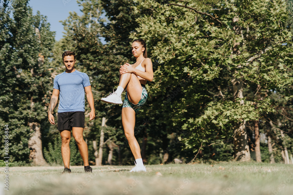Active Couple Motivated by Fresh Air Fitness in Park
