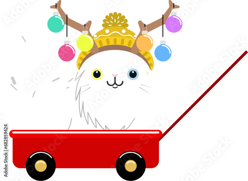 Cute white cat sitting in a red wagon wearing a knitted hat with reindeer antlers and Christmas ornaments. 