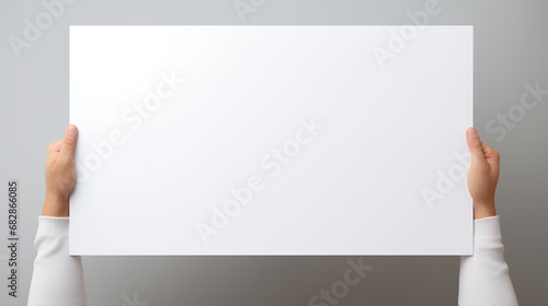 Human hand holding empty sign board, isolated on copy space with empty template, can use as Advertisement, Promotion, Campaign banners 