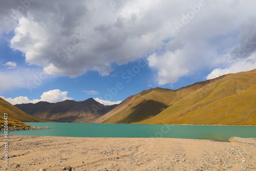 Kol Ukok lake surrounded by Tian Shan Mountains in Kochkor, Naryn region, Kyrgyzstan