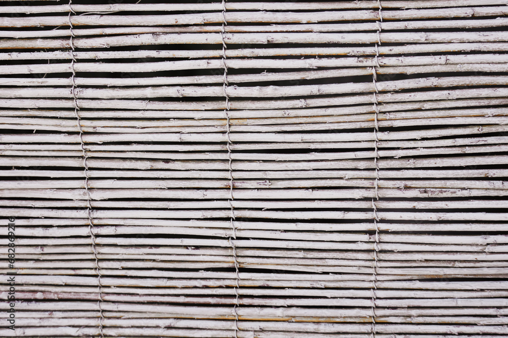 Texture of thin wooden curtain poles. Beach background.
Texture of thin wooden curtain poles. Beach background.