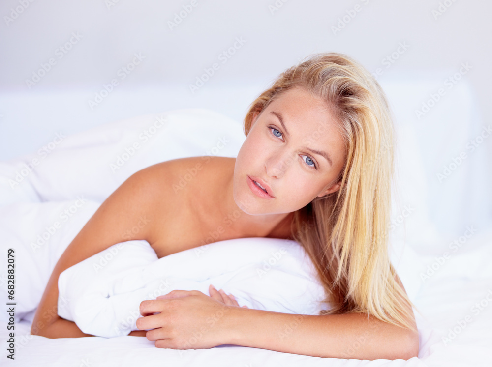 Woman, face and looking with portrait for lying on bed for relaxing, rest or peace in home. Female person, think and pose in serious expression for wake up, pillow and alone with cool, trendy or hair Woman, face and looking with portrait for lying on bed for relaxing, rest or peace in home. Female person, think and pose in serious expression for wake up, pillow and alone with cool, trendy or hair