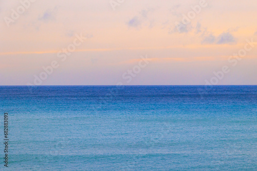 View over the sea to the mountains in the bay of Agios Georgios on the island of Corfu in the evening