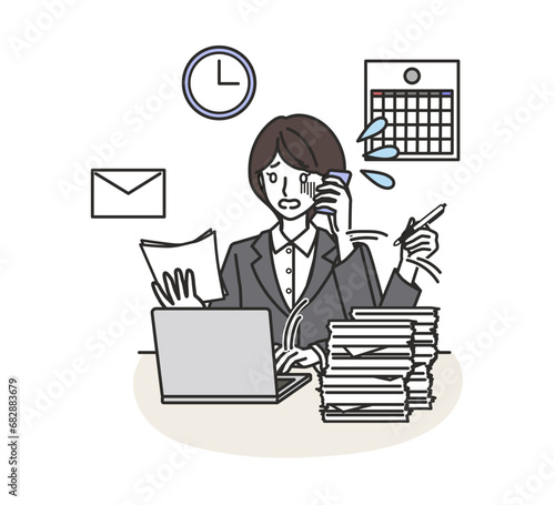 仕事に追われる女性社員
