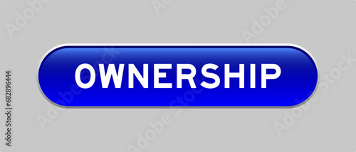 Blue color capsule shape button with word ownership on gray background