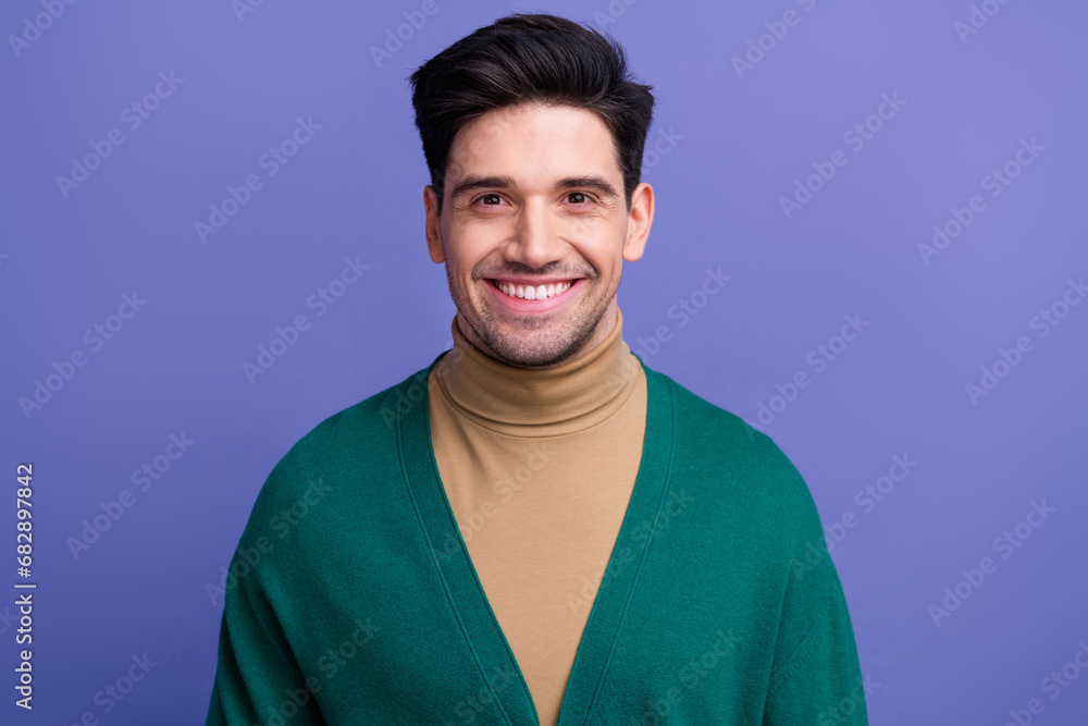 Fototapeta premium Photo of positive nice good mood man dressed green clothes isolated on purple color background