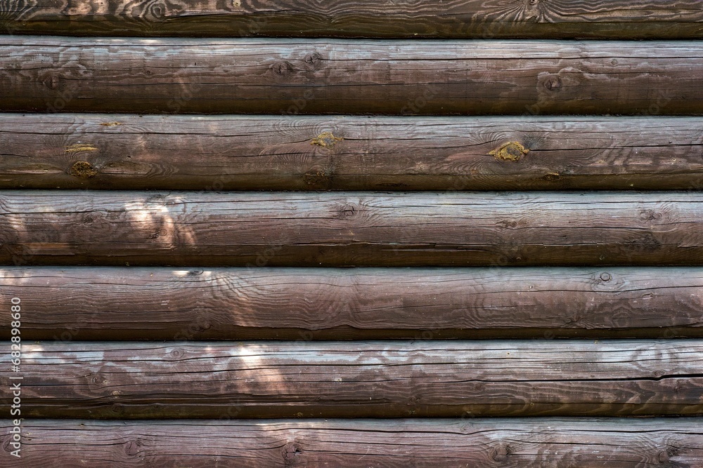 Wooden wall assembled of beams or logs Wooden wall assembled of beams or logs