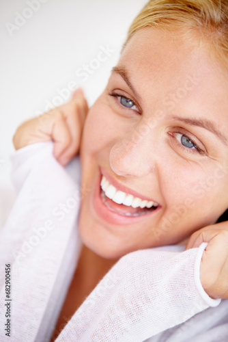 Face, happy woman and smile for closeup in home for peaceful, rest and relaxation for surprise. Female person, joyful and excited expression for choice, decision and confidence with hands for pose