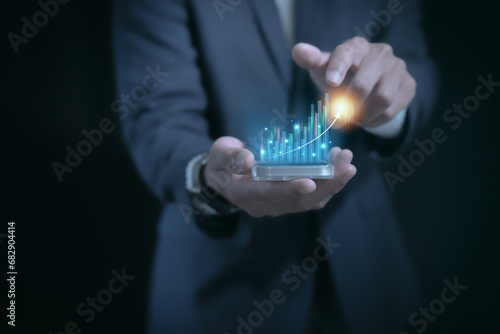 businessman typing and using on laptop holographic in the office workplace planing in work progress about investment and money management ,trading chart financial investment money management concept