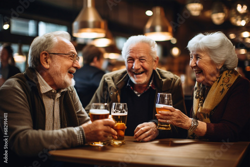 Happy elderly man and woman drinking beer in company and chatting