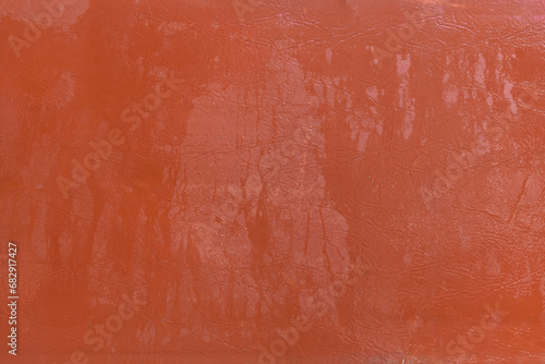 Wet water surface of orange brown leather streaks background texture