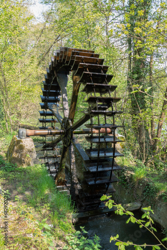 old water wheel in forest in germany