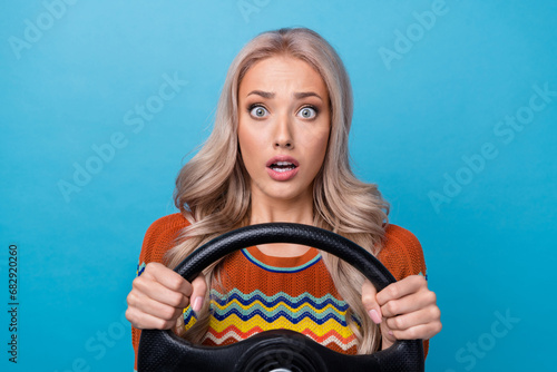Photo of pretty shocked lady wear print shirt driving car stuck in traffic jam isolated blue color background