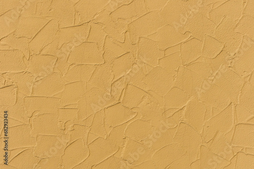Yellow bright paint abstract pattern plaster surface stucco wall texture background