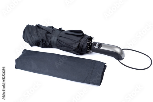 Folded men's umbrella and umbrella cover on a white background.