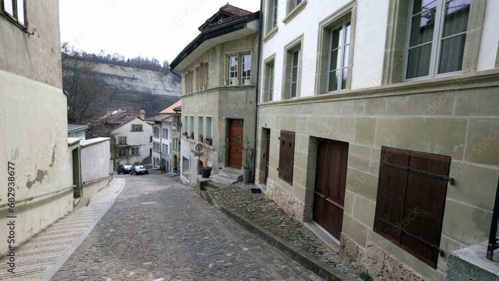 Empty traditional European street with nobody. Cobblestone sidewalk with ancient buildings