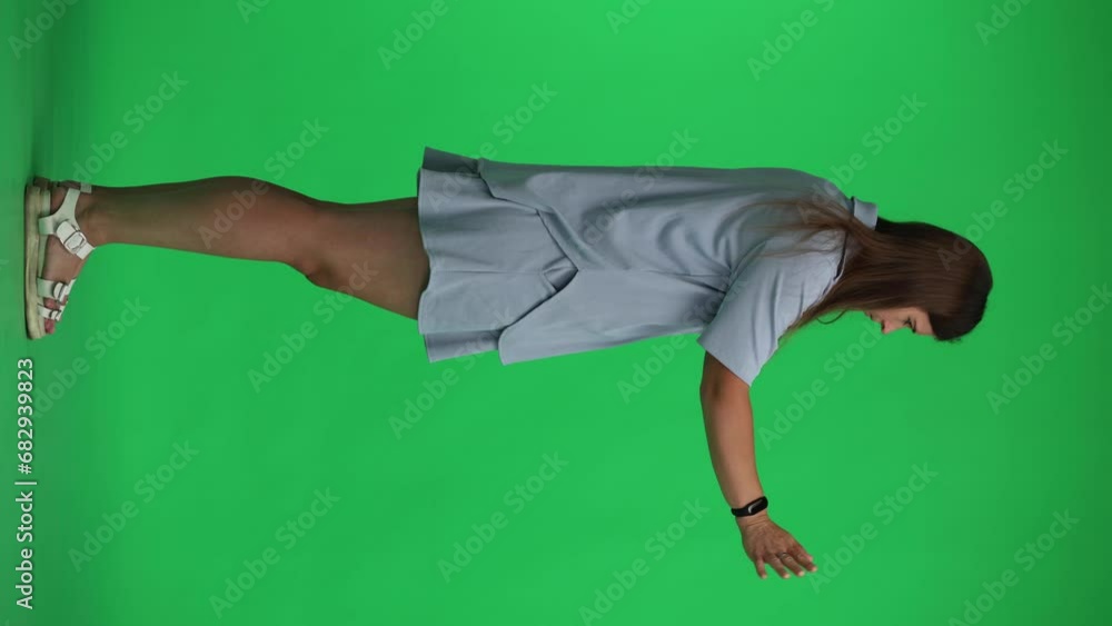 woman on a green background. in full height. shows with his hand come closer woman on a green background. in full height. shows with his hand come closer