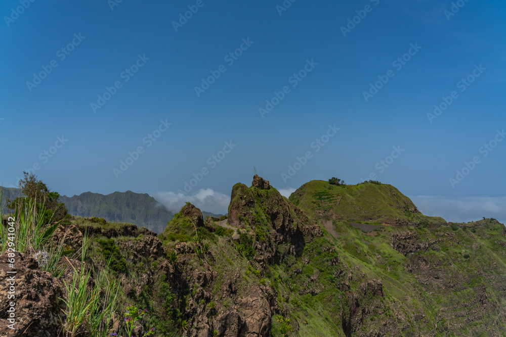 A view of top of the volcanic mountains with green grass on Santo Antao Island