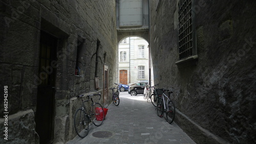 ancient back alley in Swiss city with bicycles at rest