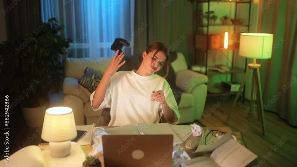 Excited cute young woman with joystick controller playing video games on laptop at late night alone Upset female lose the competition at home Defeat Game addiction concept Excited cute young woman with joystick controller playing video games on laptop at late night alone Upset female lose the competition at home Defeat Game addiction concept