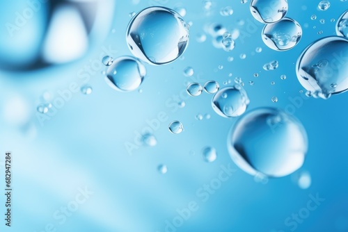 Close-up macro photo of water drops or oil bubbles on blue background.