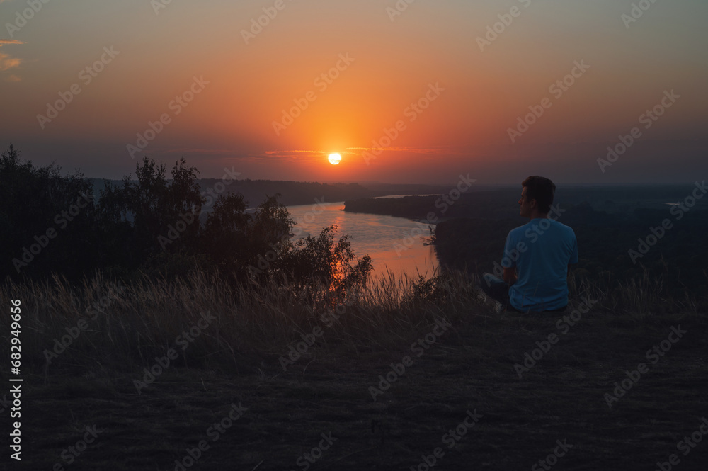 Man on the river coast landscape