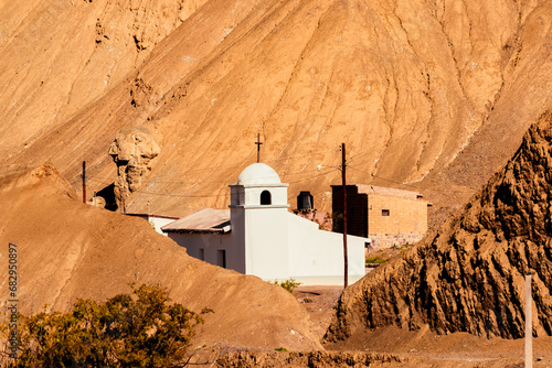 Ancient pure white adobe chapel and Spanish style, located in the upper part of Purmamarca, Jujuy, northern Argentina. photo