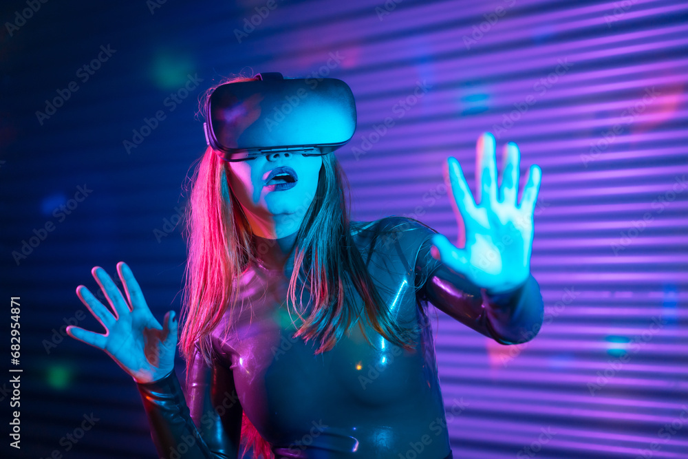 Surprised woman using augmented reality goggles in a futuristic space Surprised woman using augmented reality goggles in a futuristic space