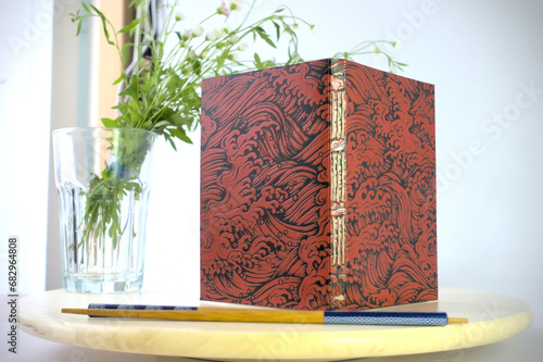 Detail of red and black Japanese binding covers - A detail of red and black Japanese binding covers
