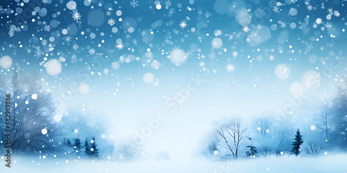 Beautiful snow-covered Christmas blue background with delicate snowflakes and small trees. Banner © evgeniia_1010