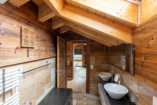 Rustic wooden bathroom interior with modern fixtures photo