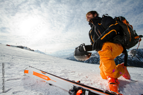 Skier in bright gear enjoying the Swiss Alps