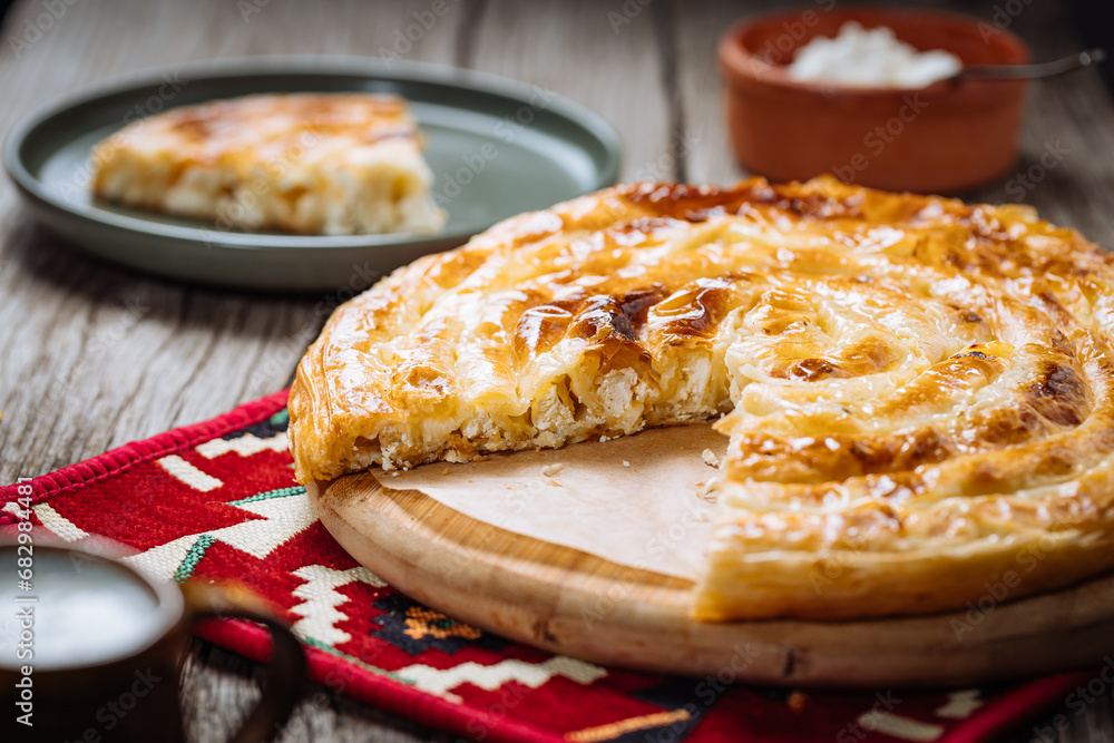 Traditional Bosnian and Turkish meal made from rolled pastry filled with spinach. In Turkey it is called Borek with cheese. In Bosnia this dish is called Pita Sirnica. Made from phyllo pastry. Traditional Bosnian and Turkish meal made from rolled pastry filled with spinach. In Turkey it is called Borek with cheese. In Bosnia this dish is called Pita Sirnica. Made from phyllo pastry.