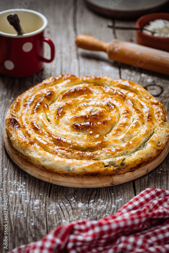 Traditional Bosnian and Turkish meal made from rolled pastry filled with spinach. In Turkey it is called Borek. In Bosnia this dish is called Pita Zeljanica. Made from phyllo  photo