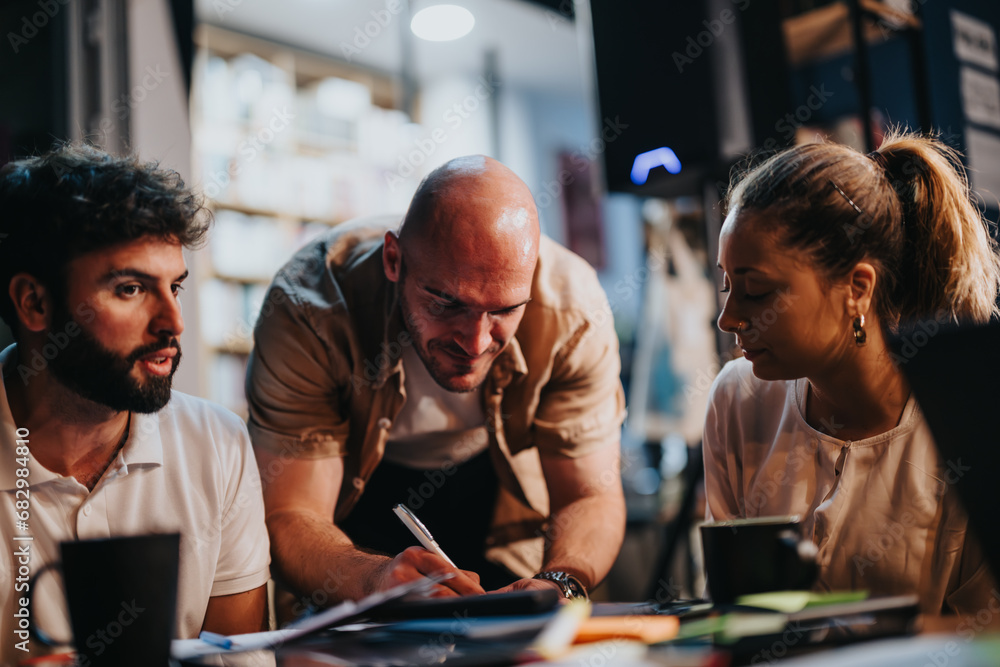 Business partners discussing project details, reviewing documents, and analyzing statistics. Successful teamwork in a casual indoor setting. Business partners discussing project details, reviewing documents, and analyzing statistics. Successful teamwork in a casual indoor setting.