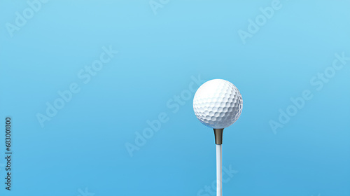 Golf ball with golf tee on a blue background with copy space