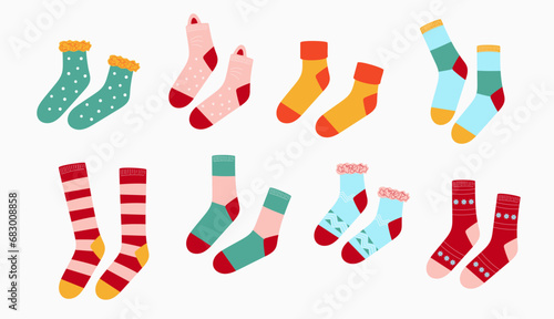 Variety of socks isolated on white background. Set of cartoon socks with colorful prints. Cute vector illustration.