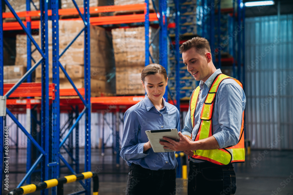 Worker in the warehouse checking the stock is on the shelves at the manufacturing. Engineer is working in the warehouse. Worker in the warehouse checking the stock is on the shelves at the manufacturing. Engineer is working in the warehouse.