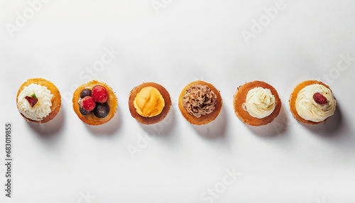  Set of delicious cakes. Small sweet cakes isolated on white background. Bakery products. Banner design