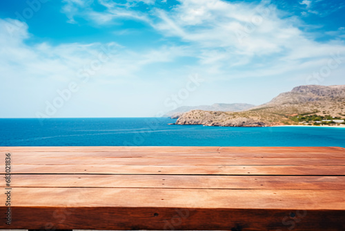 A wooden table set against the backdrop of the sea  an island  and the blue sky.Empty space for text. Bright image.